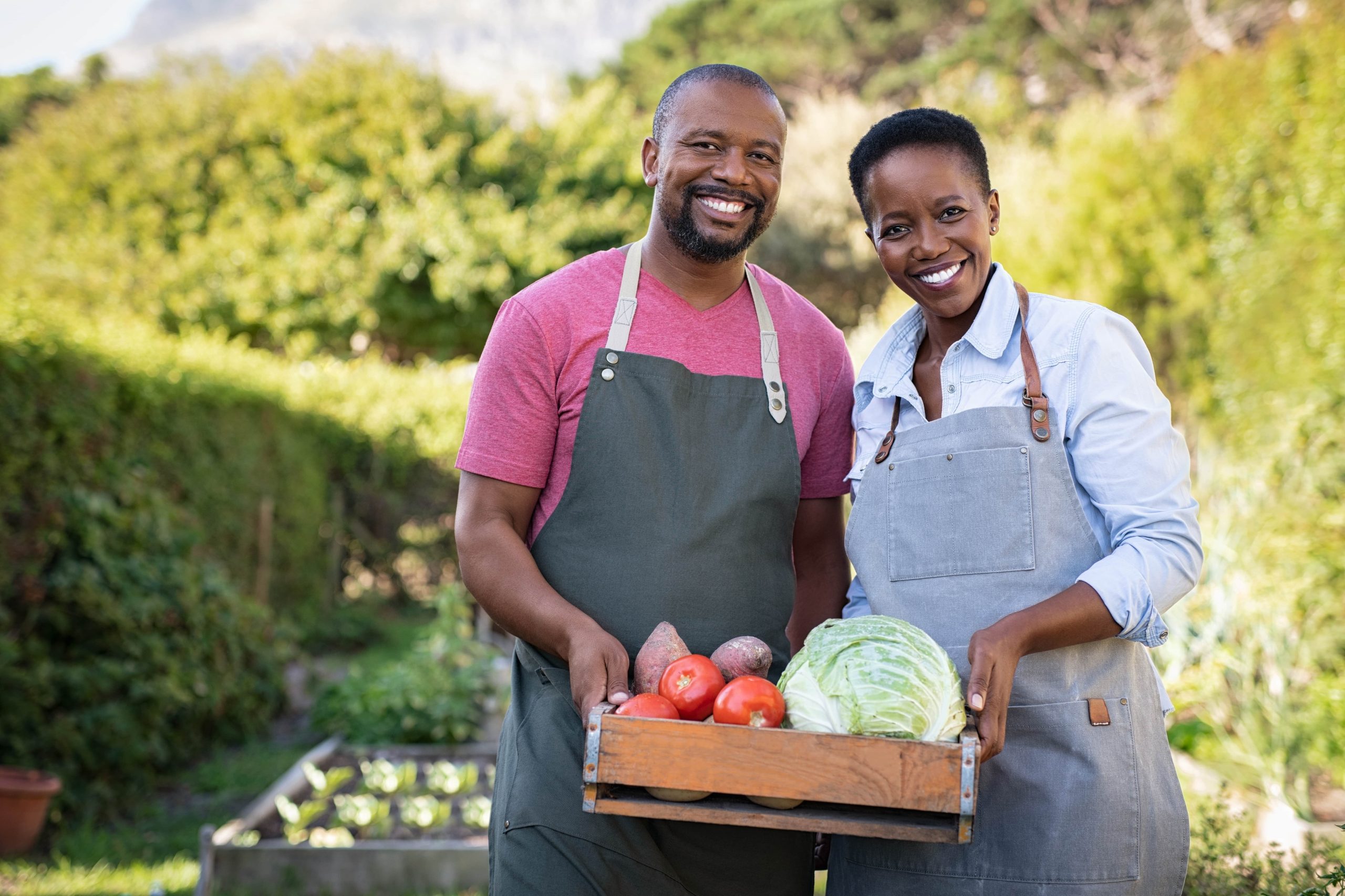 african-farmer-couple-holding-vegetable-crate-2021-08-26-15-34-43-utc-min