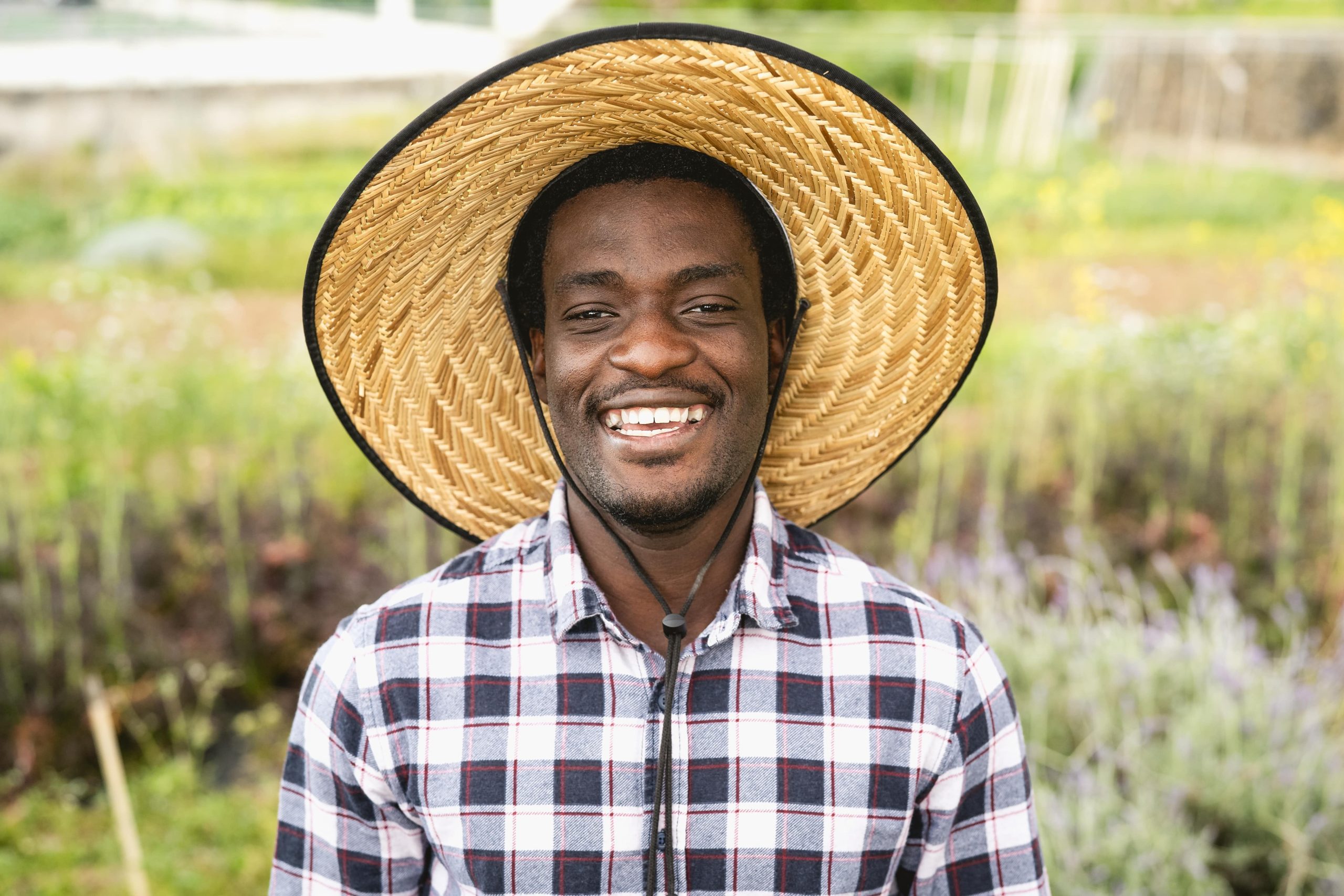 happy-african-farmer-working-in-farmhouse-country-2021-09-03-16-05-10-utc-min